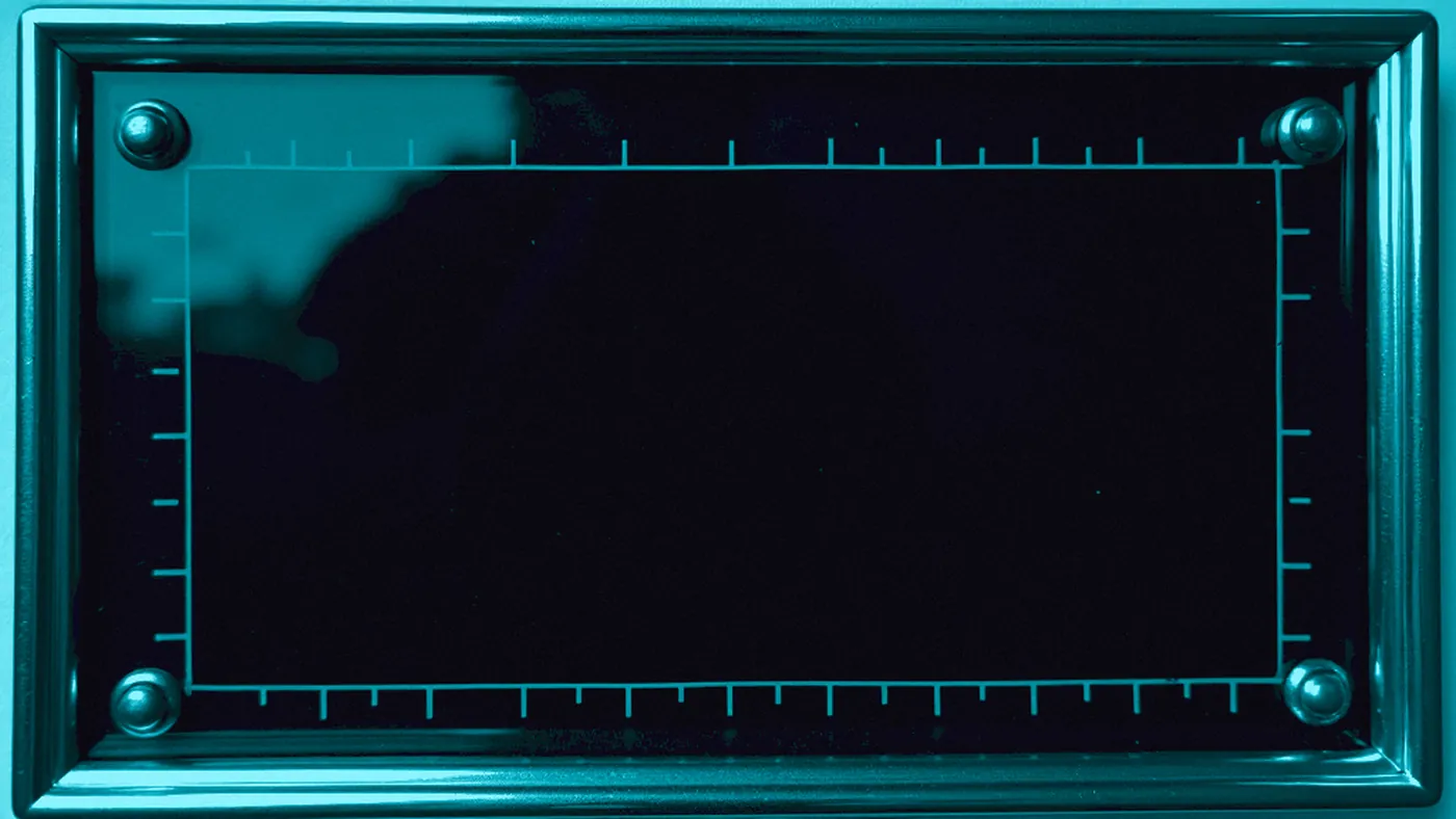 A blank instrument scope plate, relit cyan